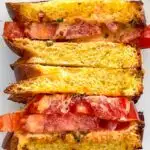Pinterest image: photo of a a Tomato Sandwich with caption reading "Tomato Sandwich with Chili Crisp Lime Mayo"