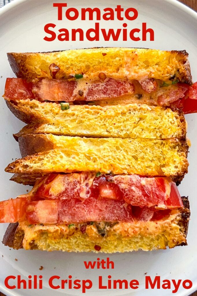 Pinterest image: photo of a a Tomato Sandwich with caption reading "Tomato Sandwich with Chili Crisp Lime Mayo"