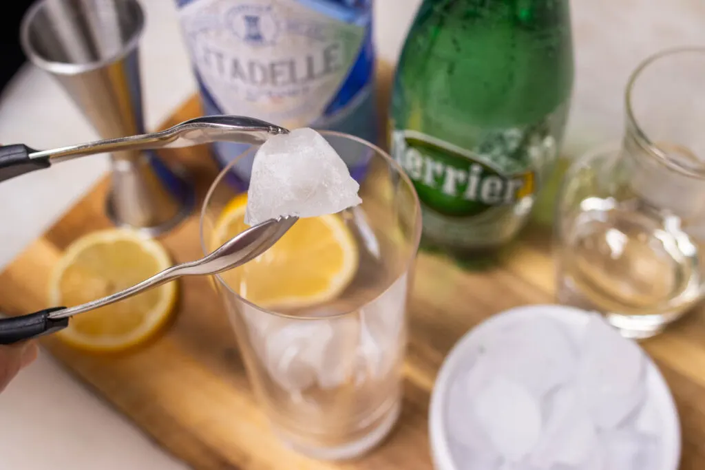 Adding Ice to a Tom Collins Cocktail