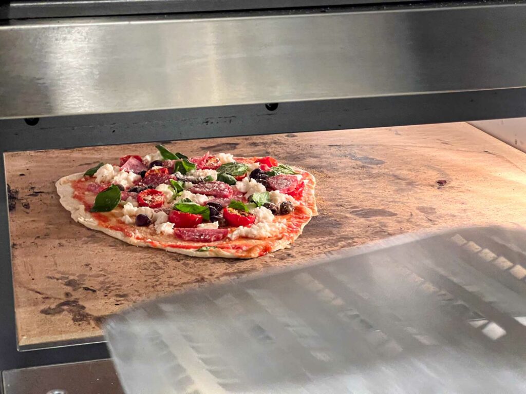 Pizza Enters the Oven at Rome Pizza Making Class