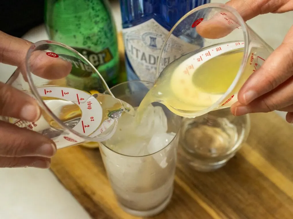 Pouring Liquids into a Tom Collins Cocktail