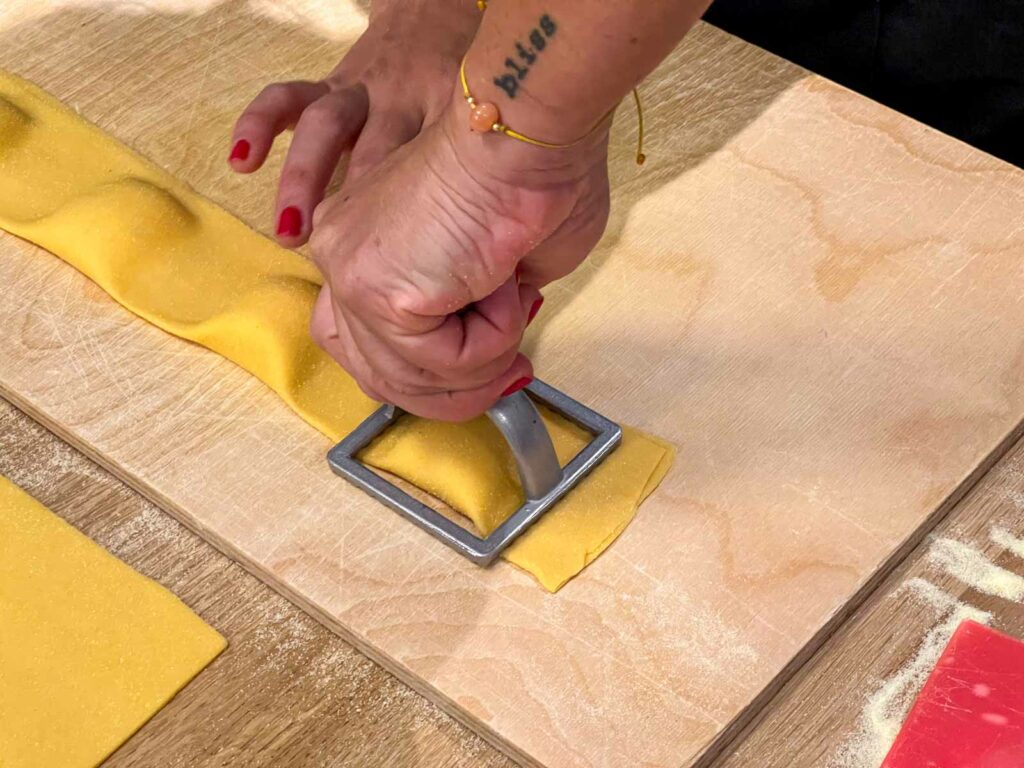Stamping Ravioli at Pasta Making Class in Rome