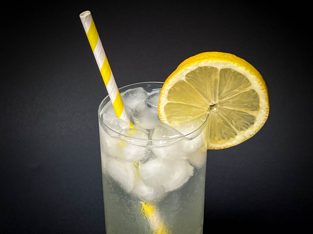 Tom Collins Cocktail with Black Background Close Up