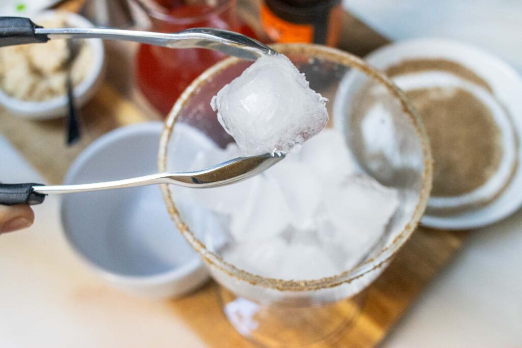 Adding Ice to a Bloody Caesar Cocktail