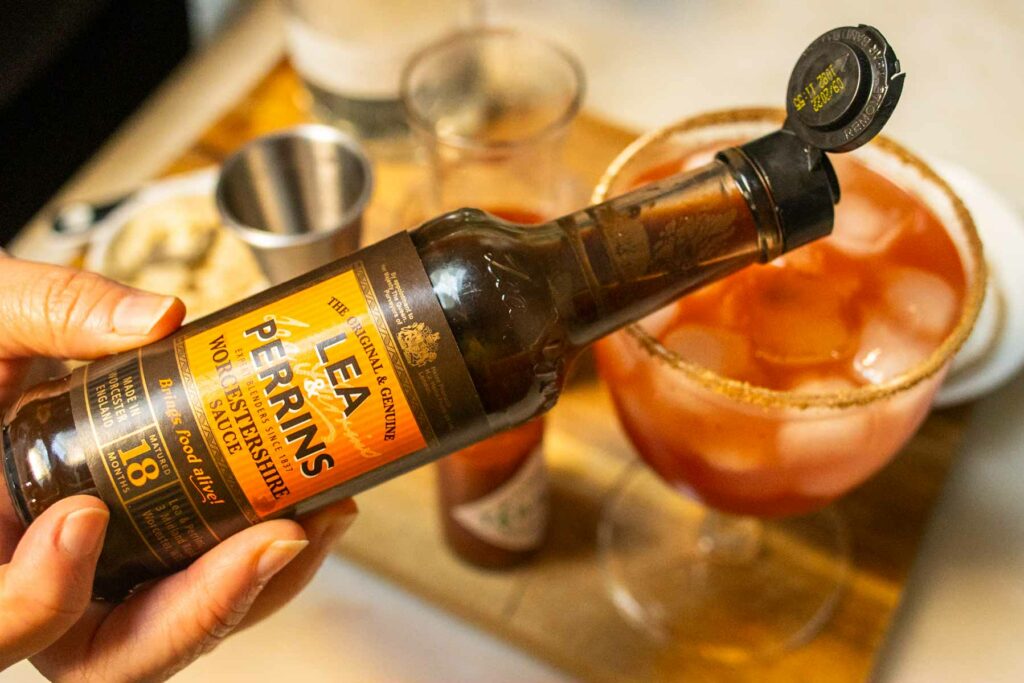 Adding Worcestershire Sauce to a Bloody Caesar Cocktail