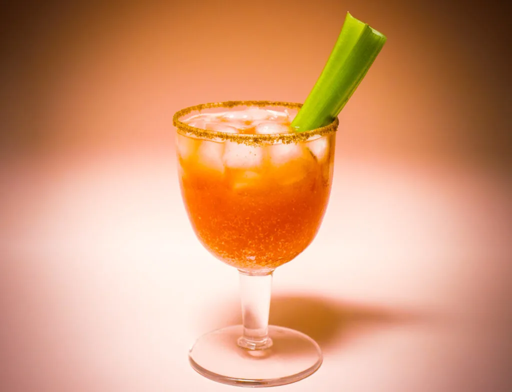 Bloody Caesar Cocktail with Peach Background
