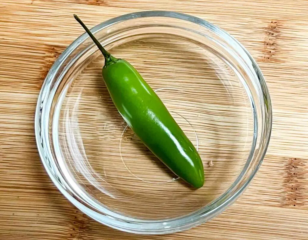 Serrano chili pepper in a glass bowl
