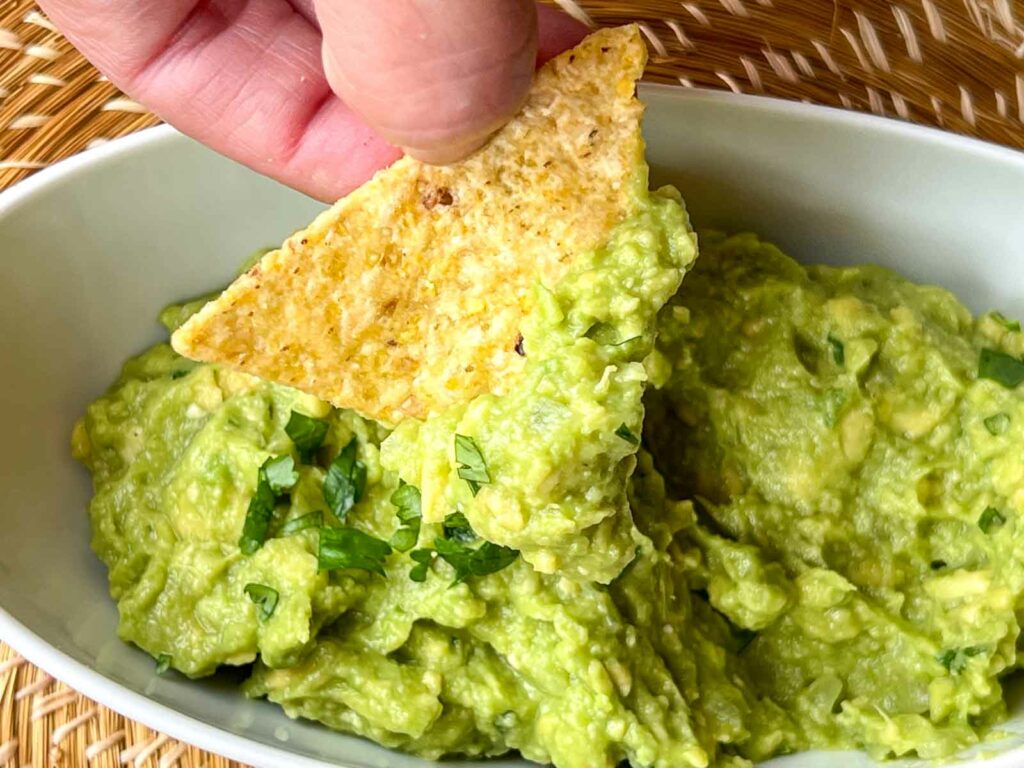 Dipping chip in Guacamole
