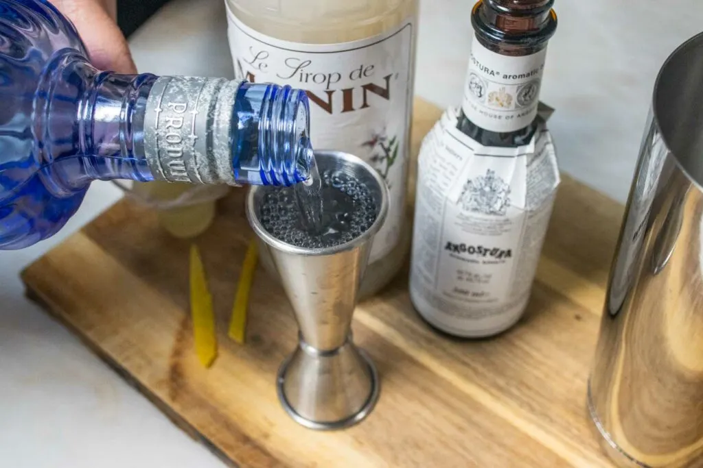 Measuring Gin for an Army and Navy Cocktail