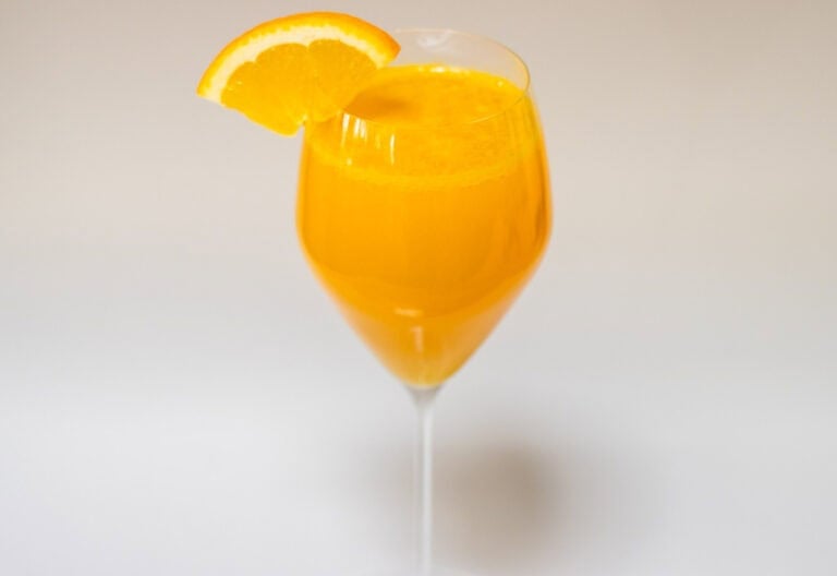 Mimosa with Orange Wedge and White Background