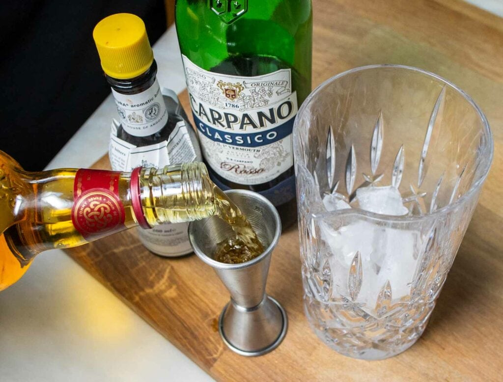 Measuring Scotch for a Rob Roy Cocktail