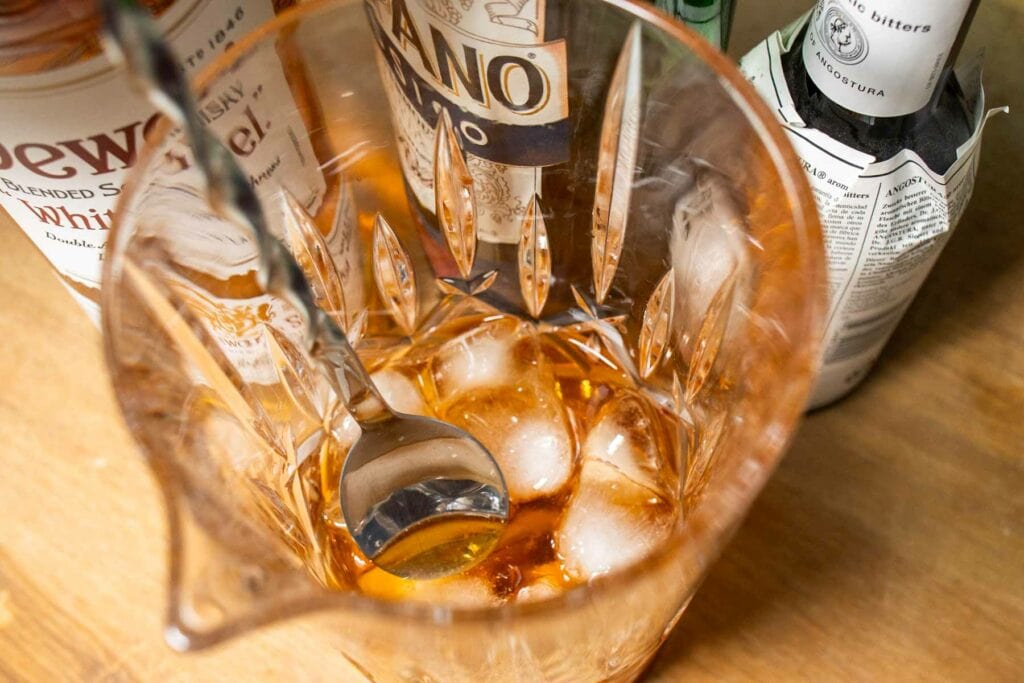 Stirring a Rob Roy Cocktail