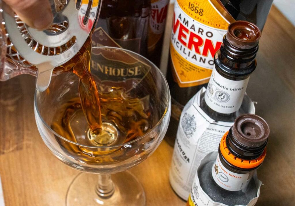 Straining a Black Manhattan