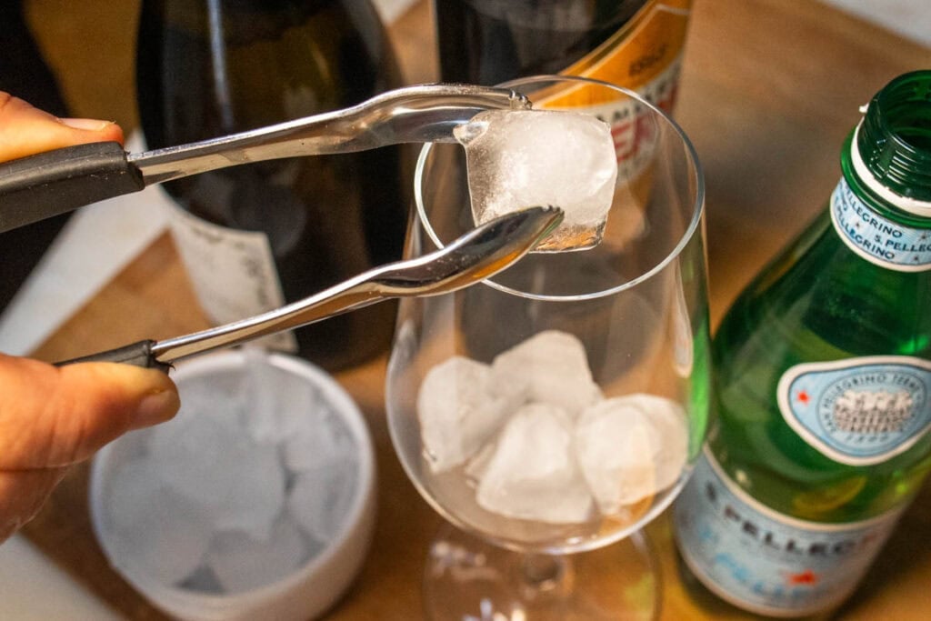 Adding Ice to an Averna Spritz