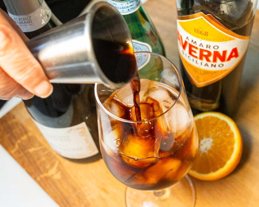 Pouring Averna into an Averna Spritz