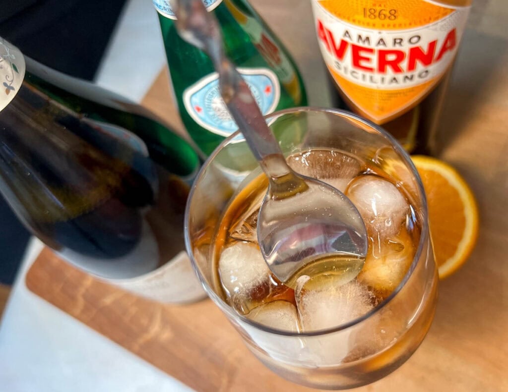 Stirring an Averna Spritz