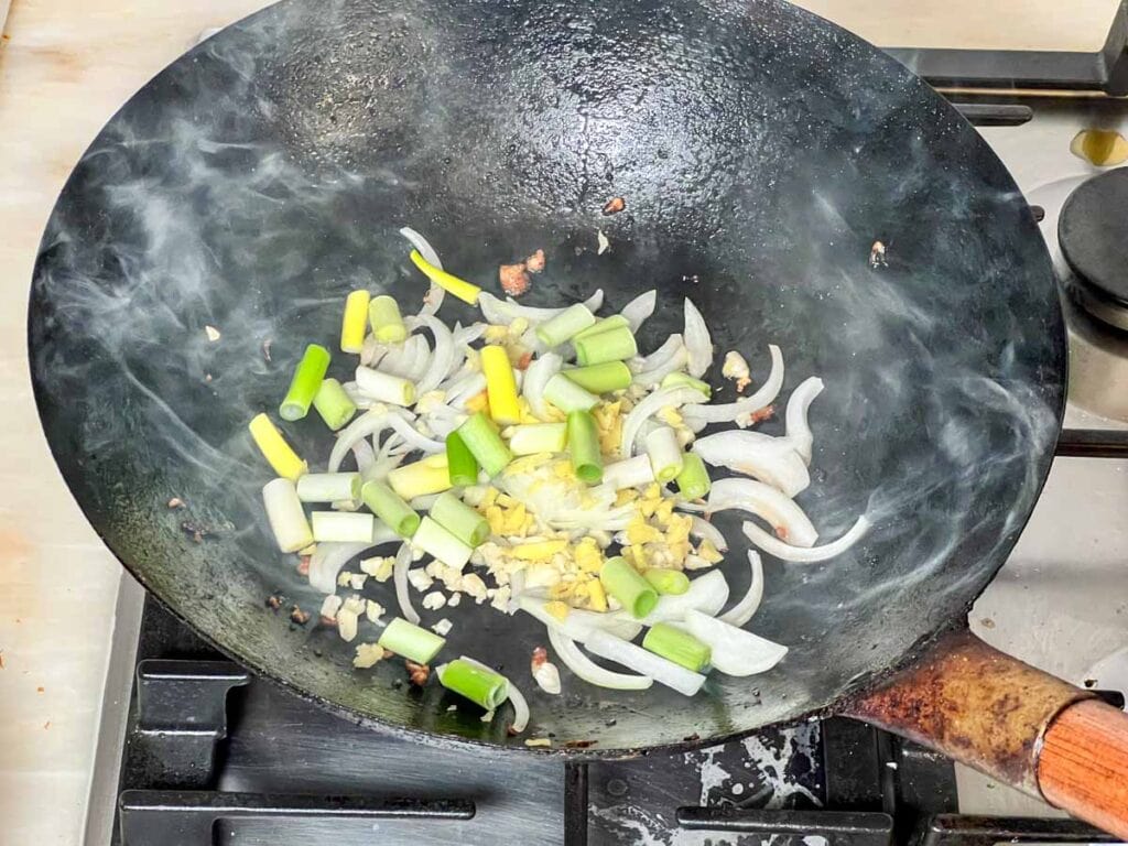 Cooking aromatics in a wok