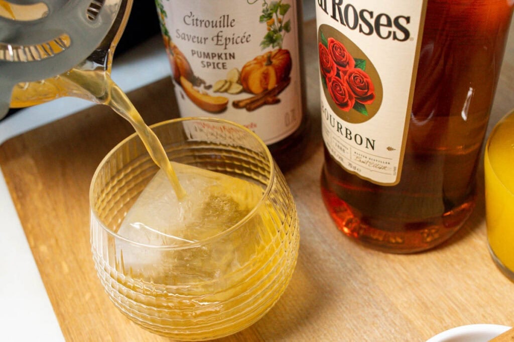 Straining a Pumpkin Bourbon Smash